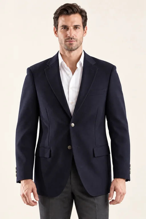 The Encore men’s navy two-button blazer, front view styled with a white shirt and charcoal trousers